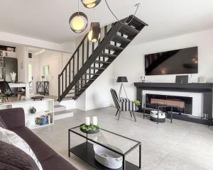 a living room with a couch and a fireplace at House Nika in Punat