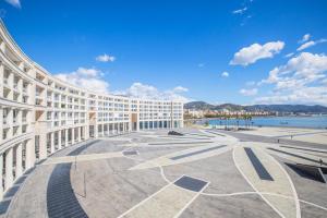 a building with a view of the water at Crescent Luxury Retreat - Seafront Apartment Scala E in Salerno