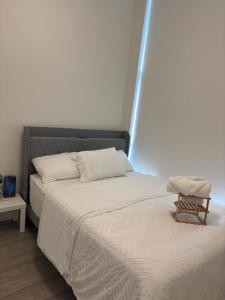 a bedroom with a bed with a black headboard at Executive 2 bed luxury Suit in Surrey