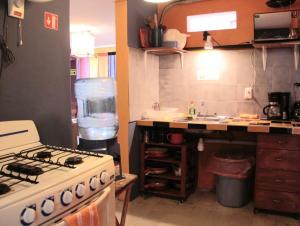 a kitchen with a stove and a sink at Isla Mujeres Punta Norte Private Bedroom 1 in Isla Mujeres