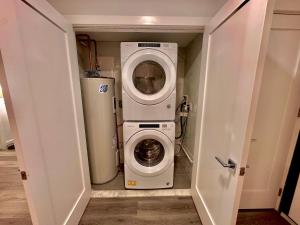 a washer and dryer in a small room at The Cozy Suite - 1BR with Free Parking in Paterson