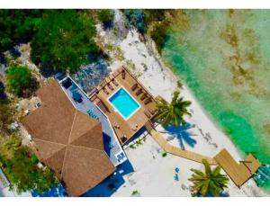 an aerial view of a house on the beach at Beach Villa Blue Bahamas in Mayaguana Island