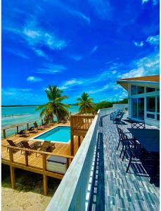 a house on the beach with a swimming pool at Beach Villa Blue Bahamas in Mayaguana Island