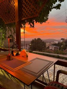 a picnic table with a view of the sunset at Fabiani Boutique Hotel Castle Gate in Krujë