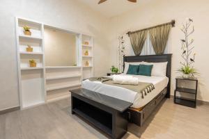 a bedroom with a large bed and shelves at "Hotel Relax" in Las Pozas +11 photos