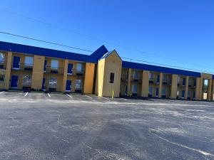 an empty parking lot in front of a building at Super 8 by Wyndham Lumberton NC in Lumberton