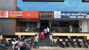 a group of motorcycles parked in front of a building at JK Suites in Rāmachandrapuram