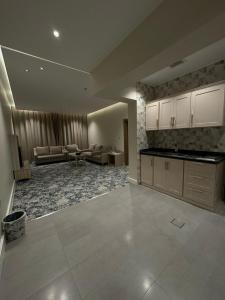 a large kitchen and living room in a house at فندق الفال الشمالي الفندقية in Ḑubā