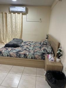 a bedroom with a bed and a air conditioner at Khan property in Islamabad