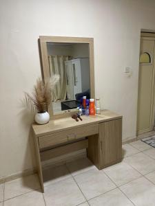 a dressing table with a mirror on top of it at Khan property in Islamabad