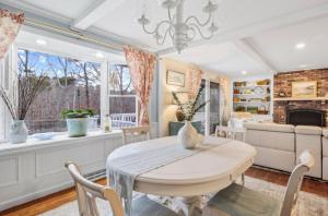 a dining room with a table and a couch at Perfect Cape Escape ! in Harwich