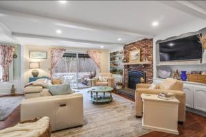 a living room filled with furniture and a fireplace at Perfect Cape Escape ! in Harwich
