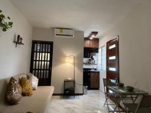 a living room with a couch and a table at Loft Residencial Monterrey Norte in Monterrey