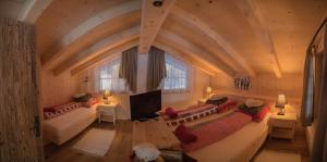 Postel nebo postele na pokoji v ubytování Braito's Seaside Lodges und Suites