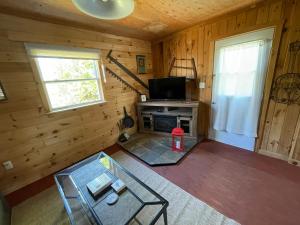 an overhead view of a living room in a log cabin at Tracadie Cottages in York