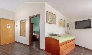 a bedroom with a bed and a flat screen tv at Central Lux - Casa Caracciolo in Castel di Sangro