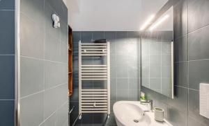 a bathroom with a sink and a mirror at Central Lux - Casa Caracciolo in Castel di Sangro +10 photos