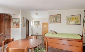 a room with a bed and a table and a dining room at Central Lux - Casa Caracciolo in Castel di Sangro