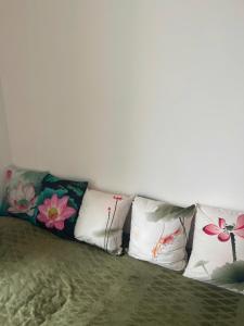 a group of pillows sitting on top of a couch at Canary Nest Solforest Ecopark Homestay in Kim Quan +40 photos