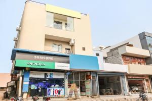 a store in front of a building at Super Hotel O Viraj Deluxe Narela in Delhi +19 photos