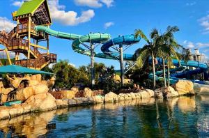 a water park with a water slide and a water slide at SpaceX R4 Shared in Orlando