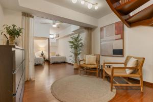 a living room with a table and chairs at Casa Carpa Andalucia IV Carabeo Playa in Nerja
