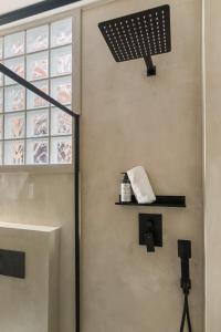 a bathroom with a wall with a window and a shelf at Casa Carpa Andalucia IV Carabeo Playa in Nerja +33 photos