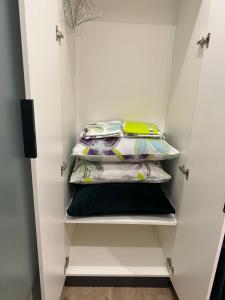 a walk in closet with four folded towels at Historical Apartments by Stepan Fedak in Lviv