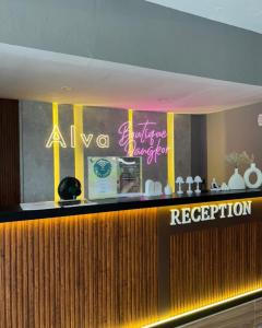 a bar in a restaurant with a neon sign at Alva Boutique Chalet Pangkor in Pangkor +18 photos