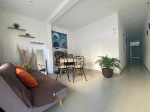 a living room with a couch and a table and chairs at Shekinah House in Cartagena de Indias +109 photos