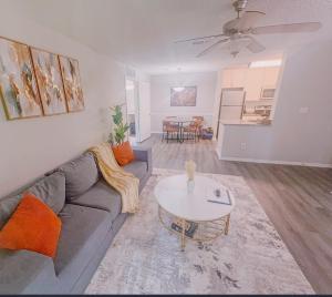 a living room with a couch and a table at Cozy ATL Retreat in Decatur