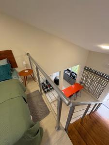a view of a room with a bed and a staircase at Casa Loft 9C in São Luís