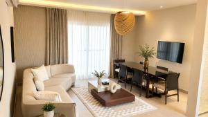 a living room with a couch and a table at Elite Residence in Accra
