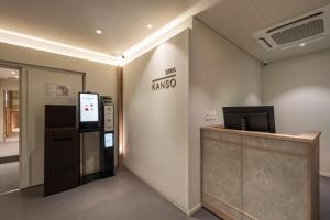 an office with a cash register and a refrigerator at Kanso Stay Jongno in Seoul
