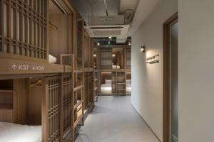 a room with a hallway with wooden cages at Kanso Stay Jongno in Seoul +37 photos