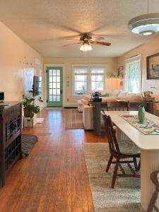 a living room with a couch and a table at Bluffton Breeze Cottage in Muskegon