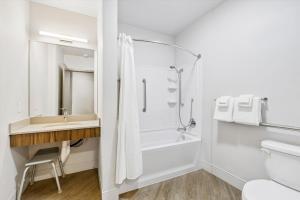 a bathroom with a shower and a sink and a toilet at Kasa Capitol Hill Seattle in Seattle