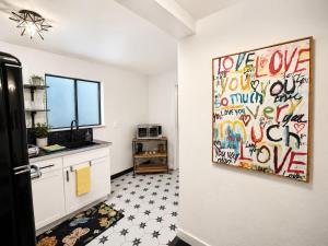 a kitchen with a painting on the wall at The Creative Escape With Community Canvas Loft in Coeur d'Alene
