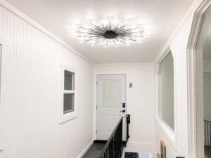 a hallway with a ceiling with a light fixture at The Creative Escape With Community Canvas Loft in Coeur d'Alene