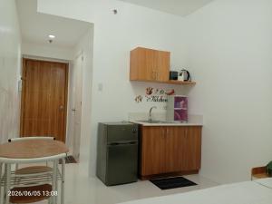 a small kitchen with a sink and a counter at Grand Riviera neas Slec in Manila