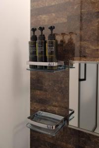 a shelf with three bottles on top of a refrigerator at グランマリーナホテル in Osaka