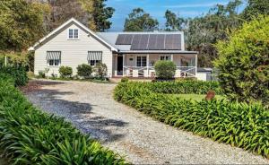 a house with solar panels on the roof at Sutton House Southern Highlands in Moss Vale