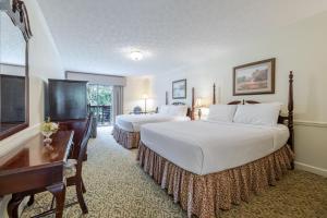 a hotel room with two beds and a television at The Dillard House in Dillard +39 photos