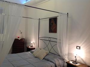 Postel nebo postele na pokoji v ubytování Antica Dimora