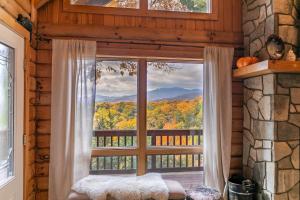 a window with a view of the mountains at Angels Envy in Lenoir
