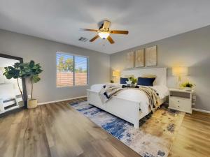 a bedroom with a white bed and a ceiling fan at Karsten Maricopa in Maricopa +27 photos