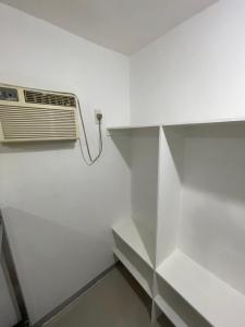 a room with a air conditioner on a wall at Kwarto-2-Go in Pontud
