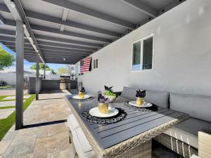 a patio with a table and a couch at Laurel Gilbert in Gilbert