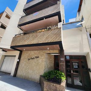 a view of the front of a building at Praia Morro Katia apartamentos - Edificio Porto Belo in Guarapari