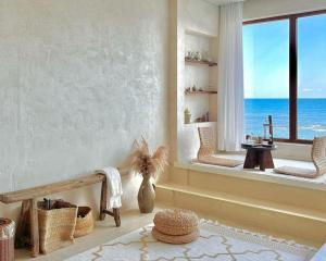 a room with a window with a view of the ocean at Ulsan Guyu Stay in Ulsan